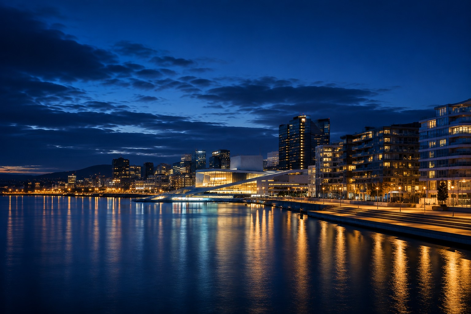 Oslo&rsquo;s skyline at night, with the Opera House and nearby towers, representing companies growing from a first share register to a stock exchange listing